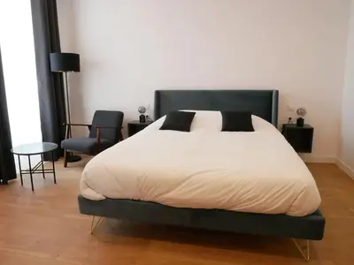 Un ou plusieurs lits dans un hébergement de l'établissement Clos de la Providence, gîte, piscine et Spa 3 chambres