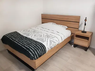 Un ou plusieurs lits dans un hébergement de l'établissement Spacieux studio – Place de la république