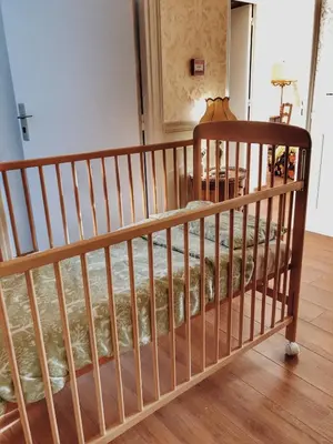 Un ou plusieurs lits dans un hébergement de l'établissement Gîte Les Roches : maison de caractère pour 15 personnes