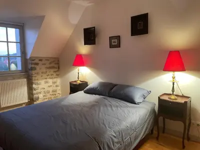 Un ou plusieurs lits dans un hébergement de l'établissement Le jardin du roitelet