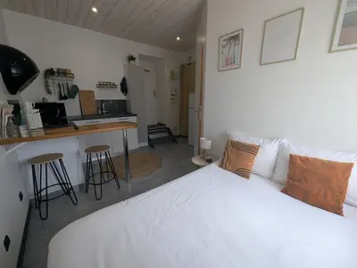 Un ou plusieurs lits dans un hébergement de l'établissement Studio cosy proche du centre-ville