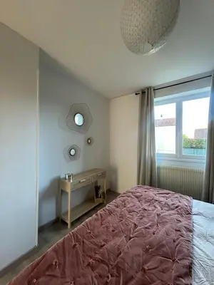 Un ou plusieurs lits dans un hébergement de l'établissement Home Lyla