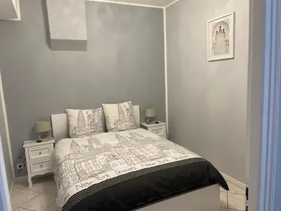 Un ou plusieurs lits dans un hébergement de l'établissement Appartement hyper centre