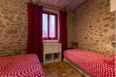 Un ou plusieurs lits dans un hébergement de l'établissement Gîte Sylvie