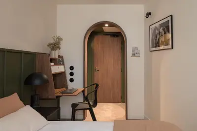 Un ou plusieurs lits dans un hébergement de l'établissement Hôtel Le Prieuré