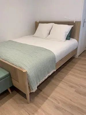 Un ou plusieurs lits dans un hébergement de l'établissement Appartement chaleureux