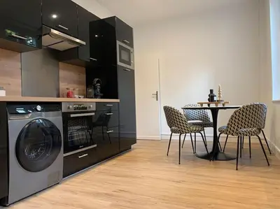 Cuisine ou kitchenette dans l'établissement Appartement chaleureux