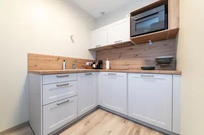 Cuisine ou kitchenette dans l'établissement Les coursives appartements