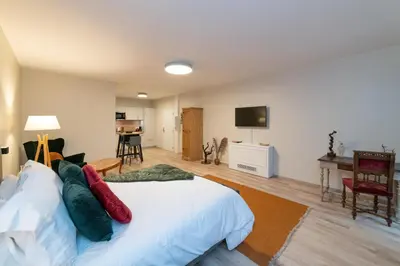 Un ou plusieurs lits dans un hébergement de l'établissement Les coursives appartements