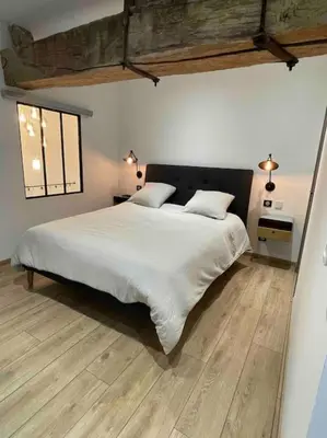 Un ou plusieurs lits dans un hébergement de l'établissement Maison Meursault parking fermé