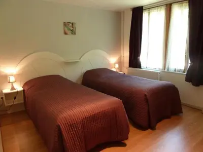 Un ou plusieurs lits dans un hébergement de l'établissement Gîte des Cèdres Ferienwohnung à Ameugny Taizé Cluny