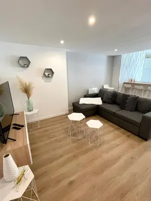 Coin salon dans l'établissement Appartement 2 chambres en plein centre ville