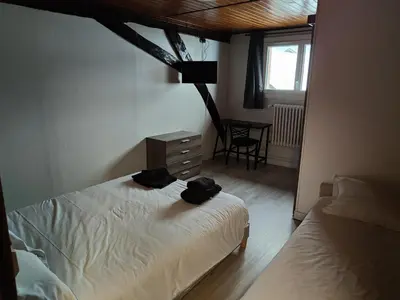 Un ou plusieurs lits dans un hébergement de l'établissement hotel du Nord
