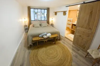 Un ou plusieurs lits dans un hébergement de l'établissement Le petit cocon de Chateau Chalon