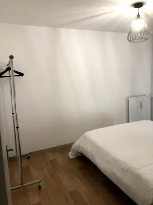 Un ou plusieurs lits dans un hébergement de l'établissement Appartement Eluard