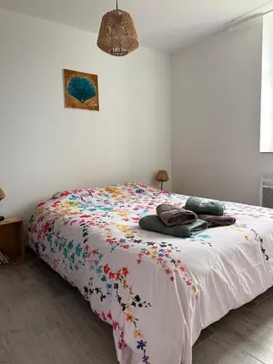 Un ou plusieurs lits dans un hébergement de l'établissement Le Pâtis Karadok - le gîte à la ferme du Karadok'Inn