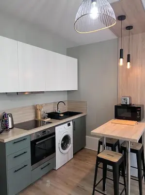 Cuisine ou kitchenette dans l'établissement Le Petit Hernoux Centre historique