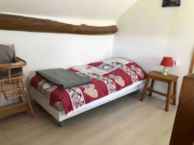 Un ou plusieurs lits dans un hébergement de l'établissement Gîte La Roussette 3 étoiles