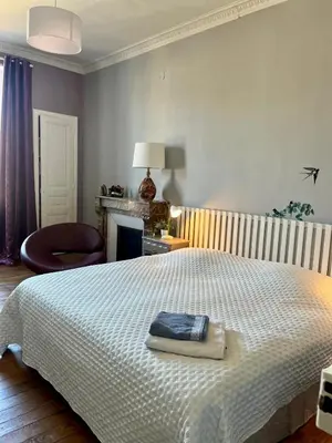 Un ou plusieurs lits dans un hébergement de l'établissement Gîte au Balcon