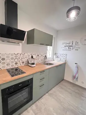 Cuisine ou kitchenette dans l'établissement Charmant appartement proche du centre ville
