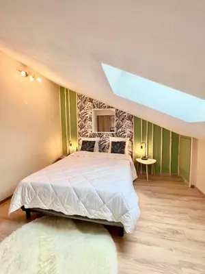Un ou plusieurs lits dans un hébergement de l'établissement Charmant appartement proche du centre ville