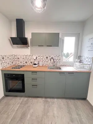 Cuisine ou kitchenette dans l'établissement Charmant appartement proche du centre ville
