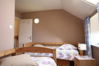 Un ou plusieurs lits dans un hébergement de l'établissement Gîte Savauldetour