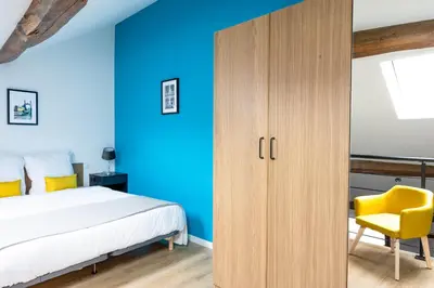 Un ou plusieurs lits dans un hébergement de l'établissement Duplex Standing - Hyper Centre - Tout équipé