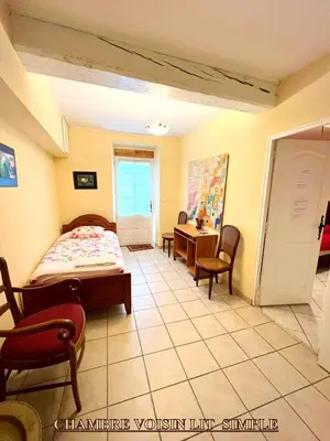 Un ou plusieurs lits dans un hébergement de l'établissement Appartement charmant à Lacrost avec jardin privé - 60 m²