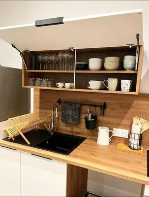 Cuisine ou kitchenette dans l'établissement Maison climatisée toute équipée