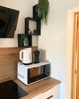 Cuisine ou kitchenette dans l'établissement Maison climatisée toute équipée