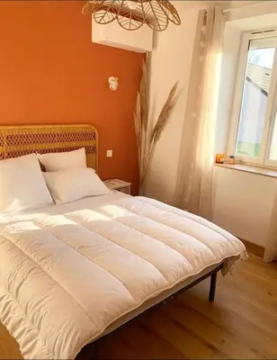 Un ou plusieurs lits dans un hébergement de l'établissement Maison climatisée toute équipée