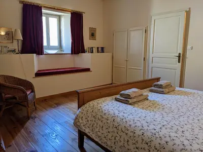 Un ou plusieurs lits dans un hébergement de l'établissement La Terrasse - Ancienne Maison de Vigneron à St Gengoux