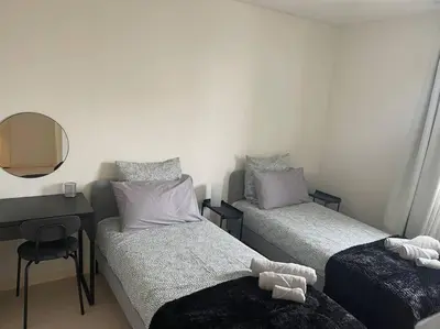 Un ou plusieurs lits dans un hébergement de l'établissement Maison entière Chenôve avec jardin