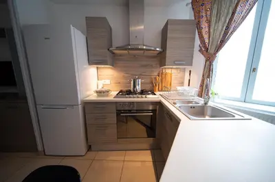 Cuisine ou kitchenette dans l'établissement Appartement haut de gamme Centre ville