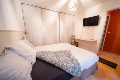 Un ou plusieurs lits dans un hébergement de l'établissement Appartement haut de gamme Centre ville