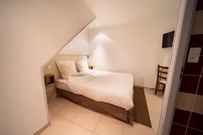 Un ou plusieurs lits dans un hébergement de l'établissement Appartement haut de gamme Centre ville