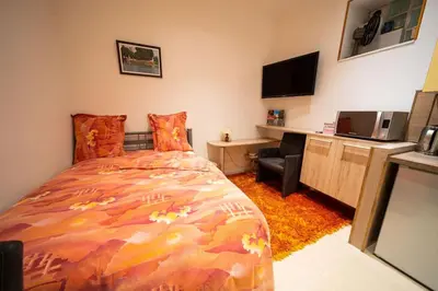 Un ou plusieurs lits dans un hébergement de l'établissement Studio Premium City center