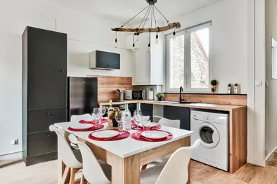 Cuisine ou kitchenette dans l'établissement Appartement Le Chaleureux Chalon - Hyper-Centre
