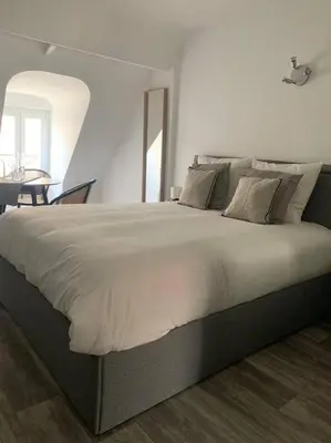 Un ou plusieurs lits dans un hébergement de l'établissement appartement catimini