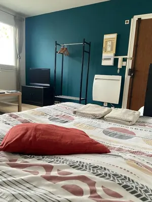 Un ou plusieurs lits dans un hébergement de l'établissement Dijon - Grand studio proche parc Darcy & gare