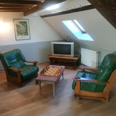 Télévision ou salle de divertissement dans l'établissement Entre vigne et rivière