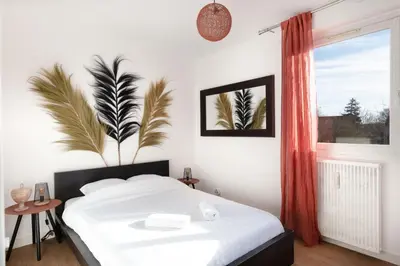 Un ou plusieurs lits dans un hébergement de l'établissement Cabana & Le Grand Appartement Lumineux