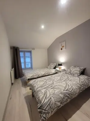 Un ou plusieurs lits dans un hébergement de l'établissement Appartement Le Duplex