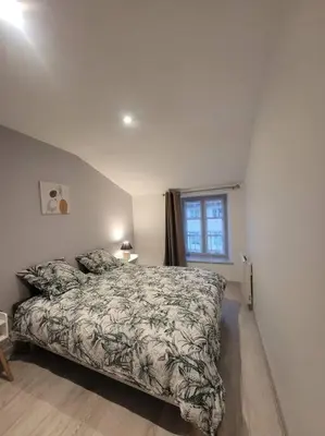 Un ou plusieurs lits dans un hébergement de l'établissement Appartement Le Duplex