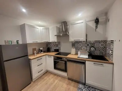 Cuisine ou kitchenette dans l'établissement Appartement Le Duplex