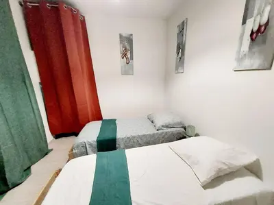 Un ou plusieurs lits dans un hébergement de l'établissement Maison cosy 3 chambres à la campagne