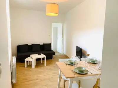 Coin salon dans l'établissement Appartement plein centre