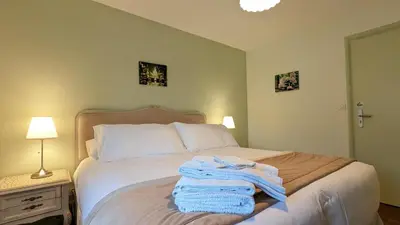 Un ou plusieurs lits dans un hébergement de l'établissement Chambres d'Hotes CASCAROT