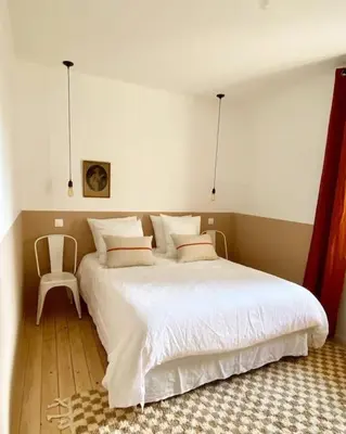 Un ou plusieurs lits dans un hébergement de l'établissement L’appartement 39